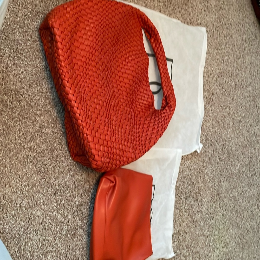 Knock off bag. Pretty orange. I do think is fake leather. Never used